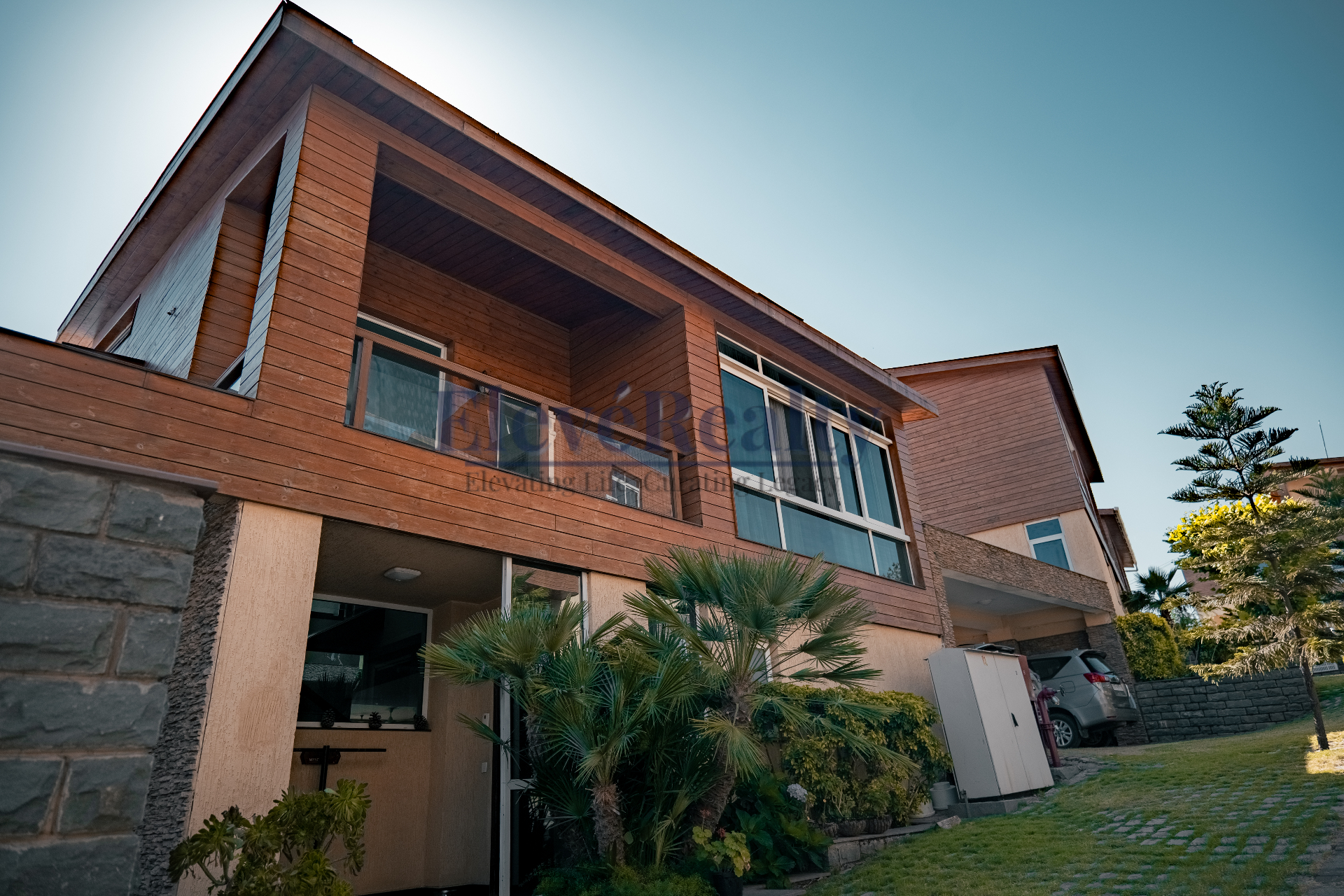 Front exterior facade of the villa with timber cladding