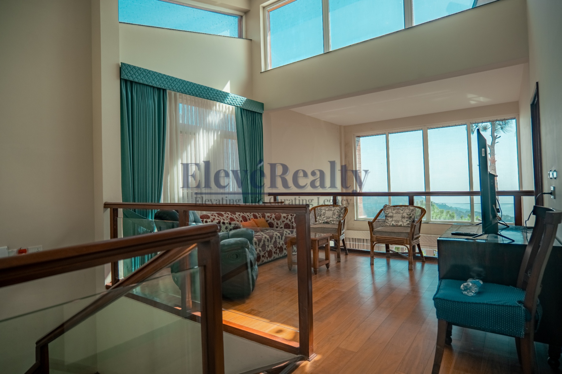 Upper lounge overlooking the valley through full-height windows
