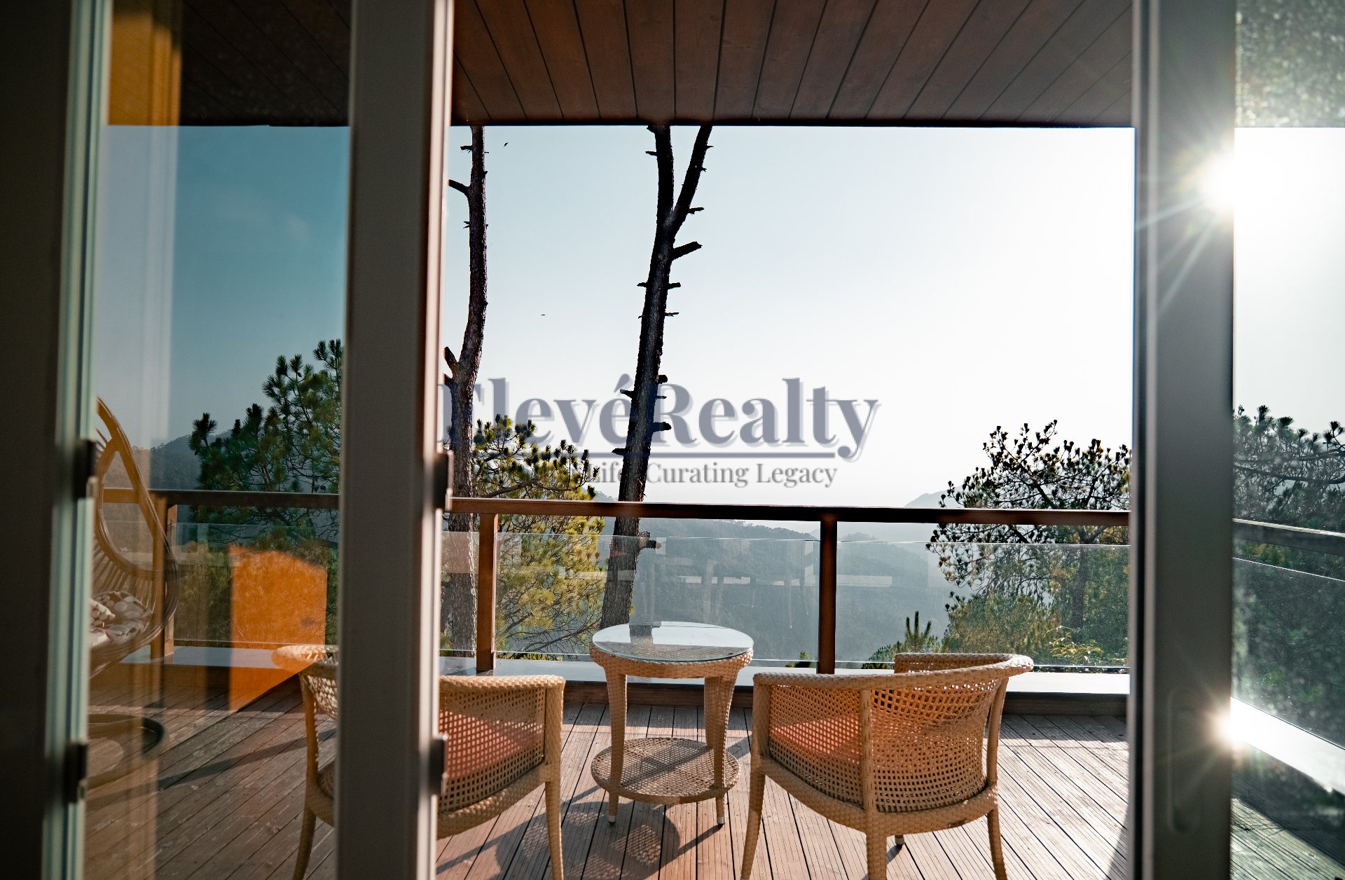 Sunlit deck seating area viewed from inside the villa