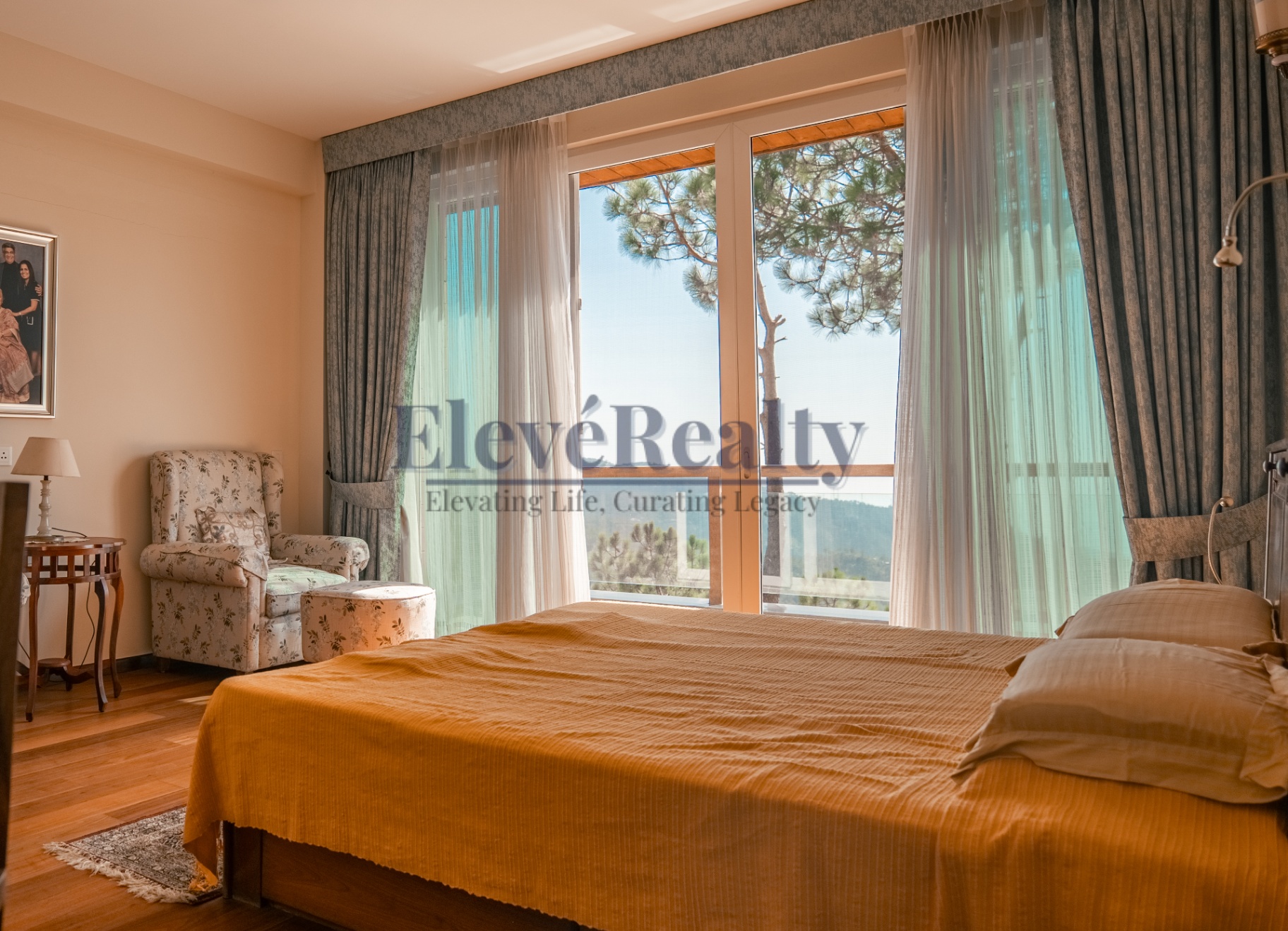 Bedroom with large glazed doors opening to the hillside view
