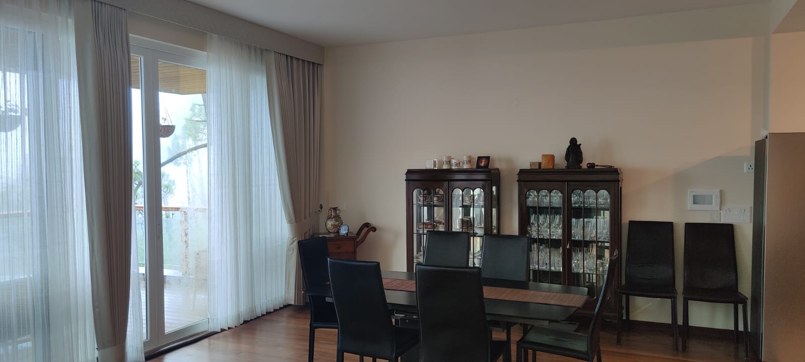 Dining area with vintage glass cabinets